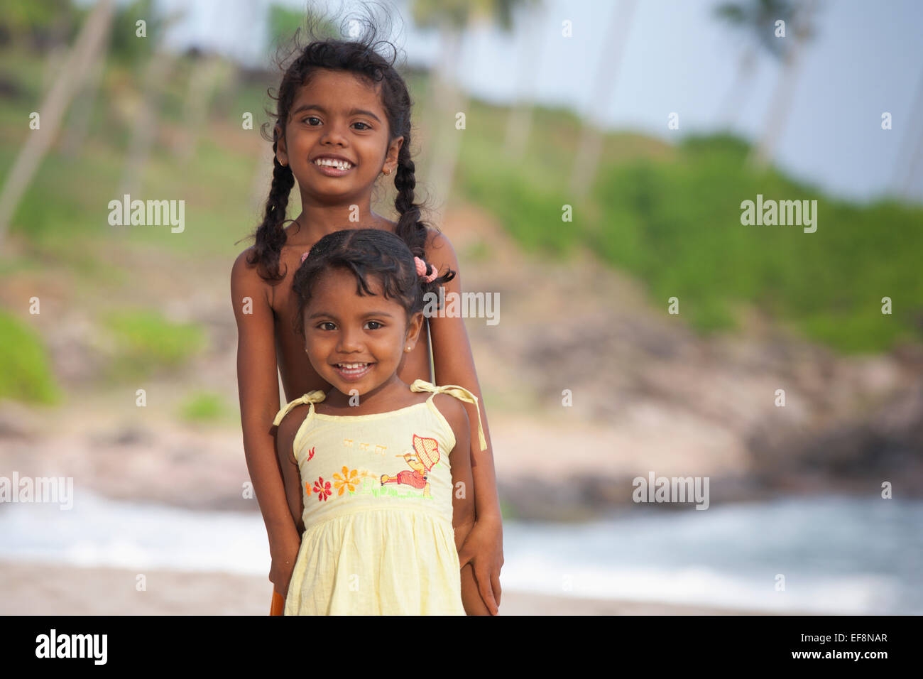 SRI LANKAN CHILDREN PLAYING ON GOYAMBOKKA BEACH NEAR TANGALLA Stock Photo