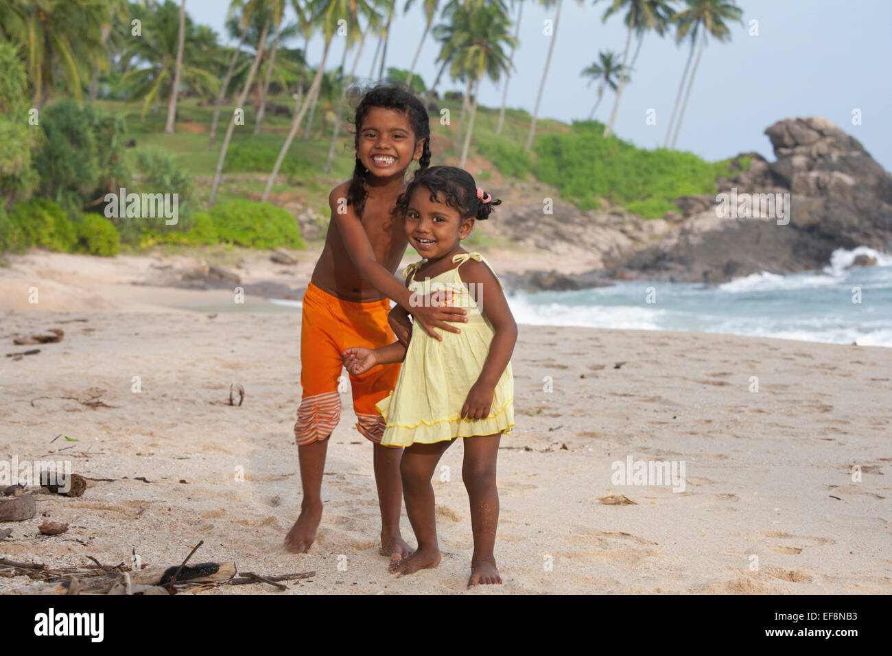 SRI LANKAN CHILDREN PLAYING ON GOYAMBOKKA BEACH NEAR TANGALLA Stock Photo