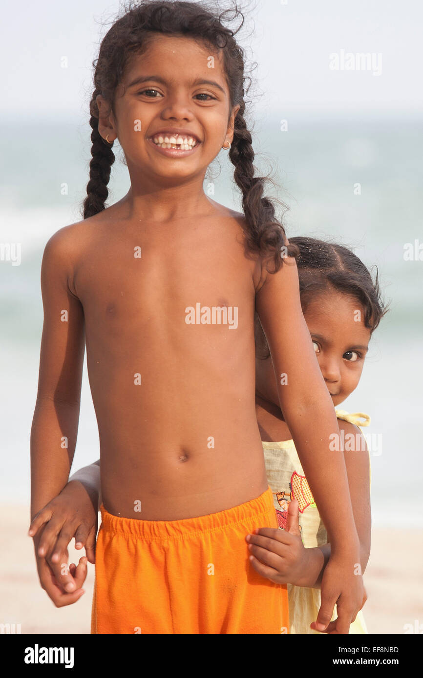 SRI LANKAN CHILDREN PLAYING ON GOYAMBOKKA BEACH NEAR TANGALLA Stock Photo