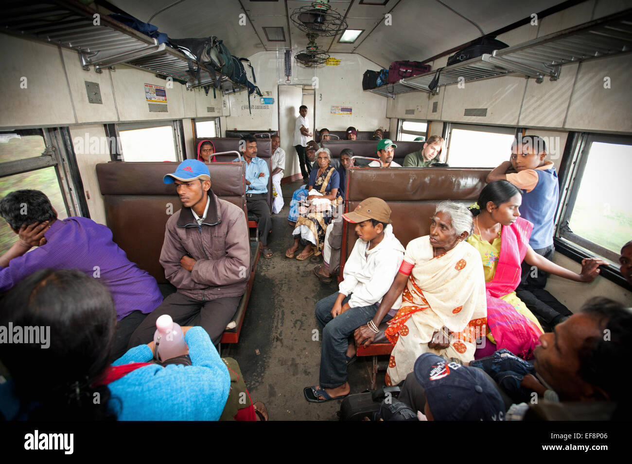 PASSENGERS ON TRAIN IN HILL COUNTRY NEAR HAPUTALE Stock Photo
