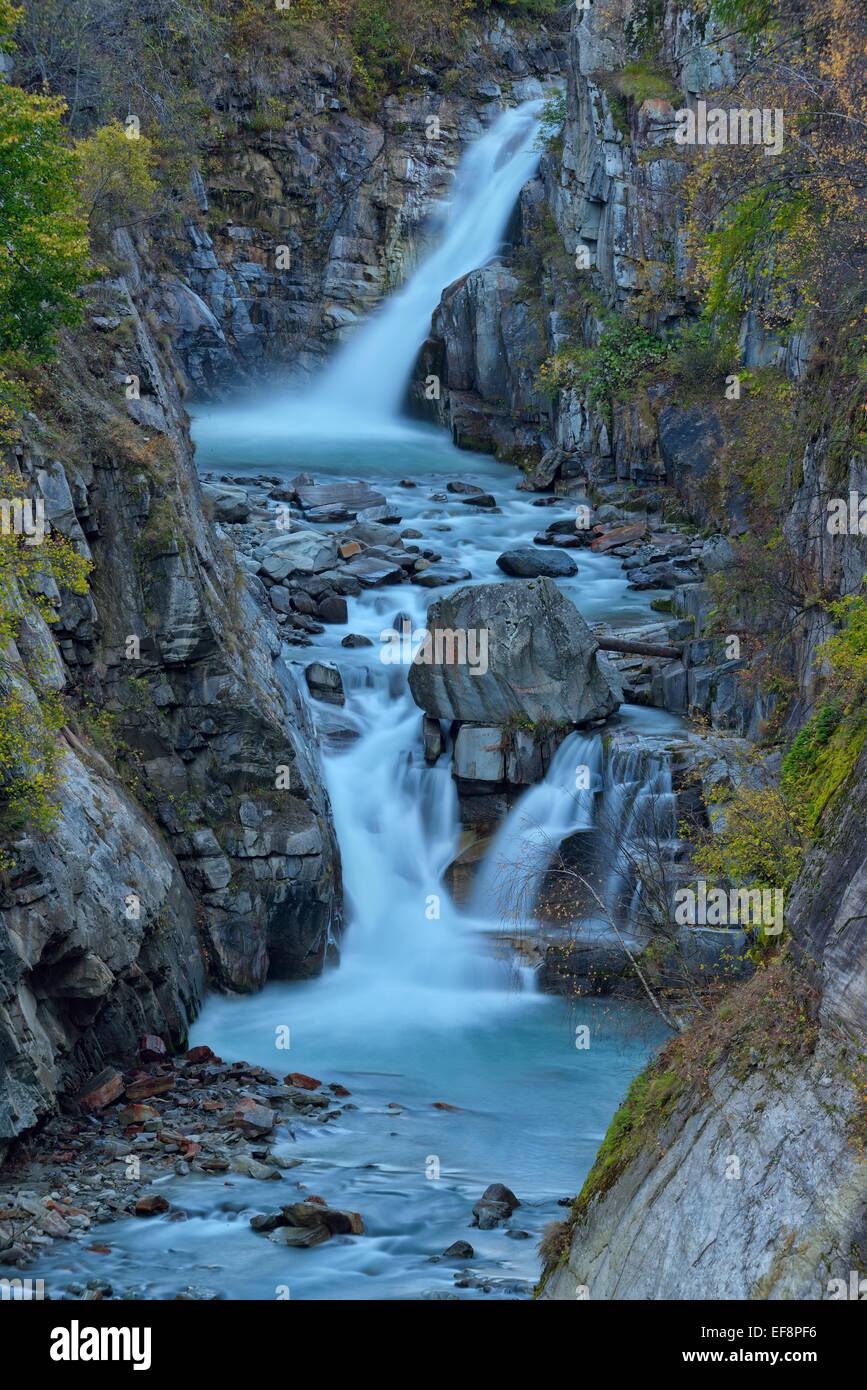 Waterfalls of the Grand Eyvia in autumn, Gran Paradiso National Park, Valle di Cogne, Piedmont, Italy Stock Photo