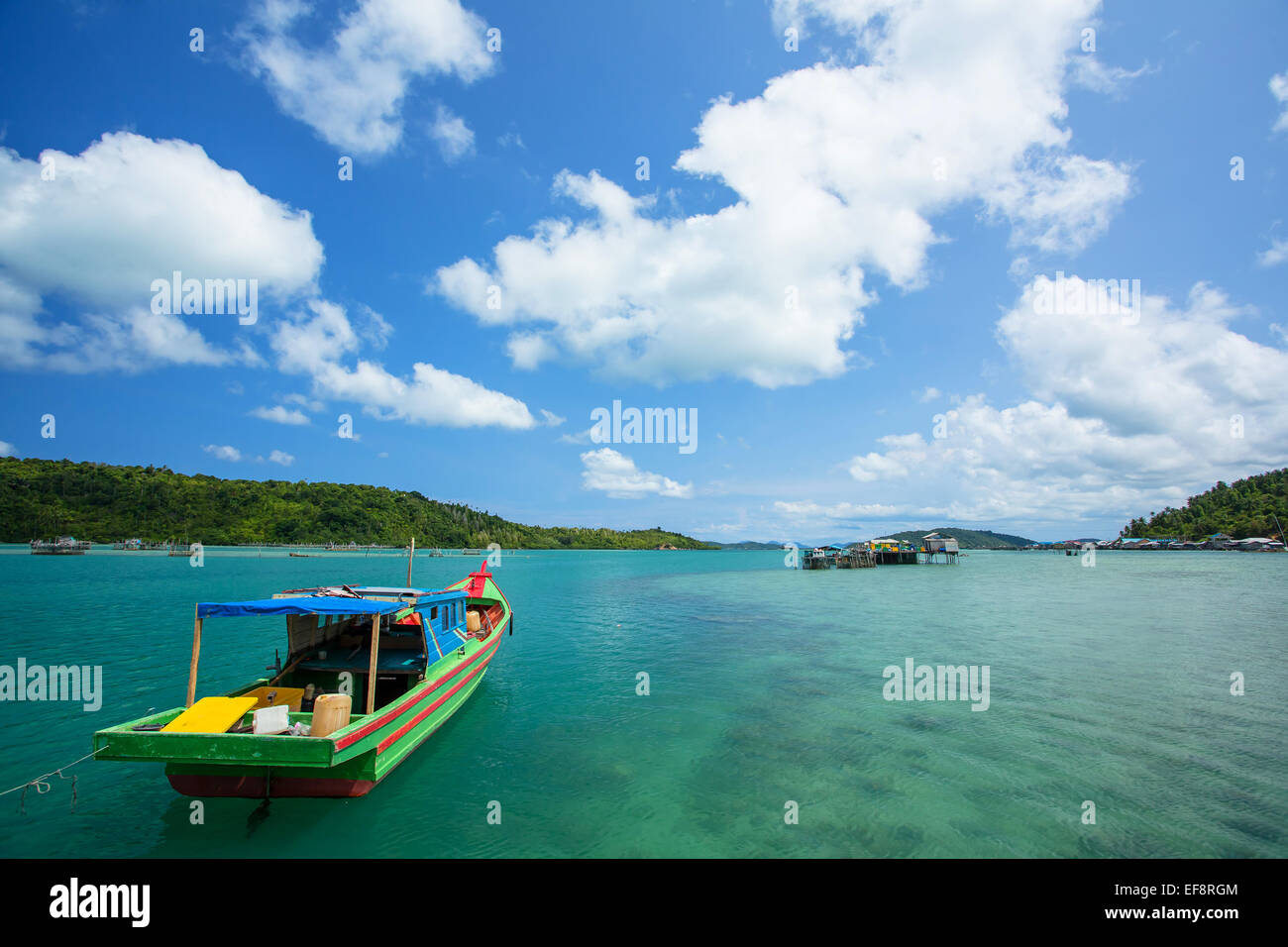 Indonesia, Riau Islands, Pulau Matak, Emerald Sea, Moored boat at bay Stock Photo