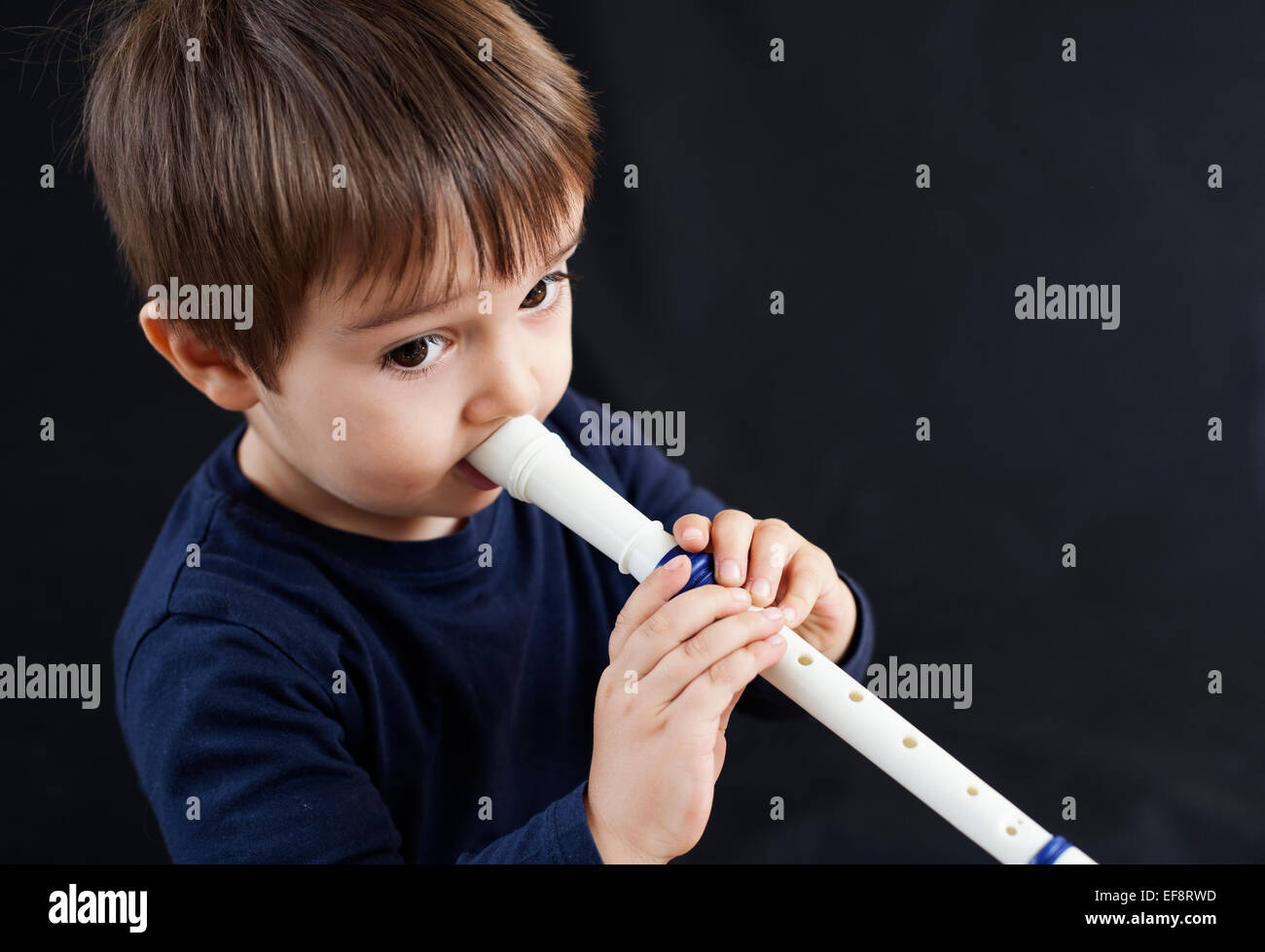 Boy playing a recorder Stock Photo Alamy