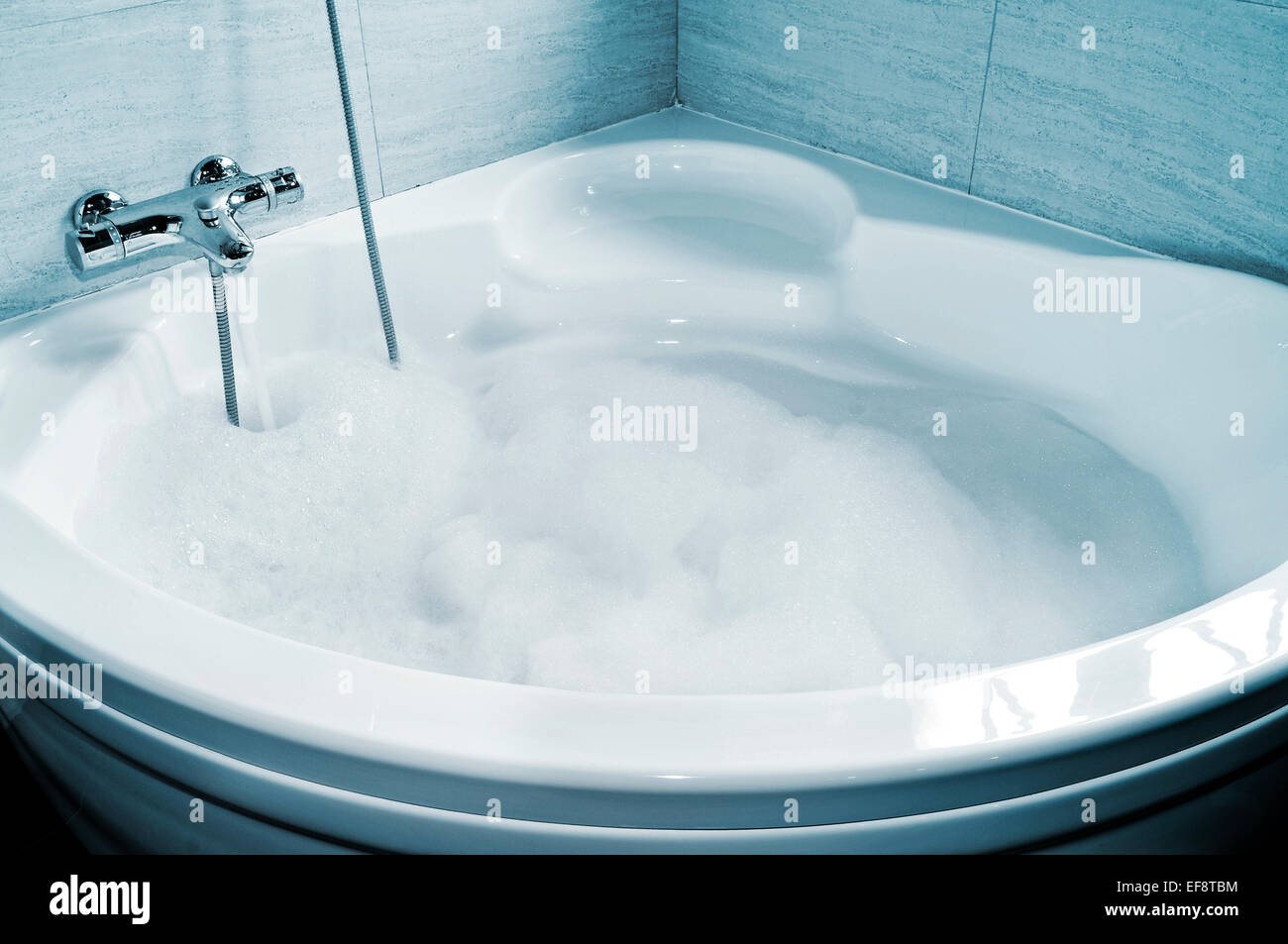 a whirlpool bath full of foam ready to take a bath Stock Photo