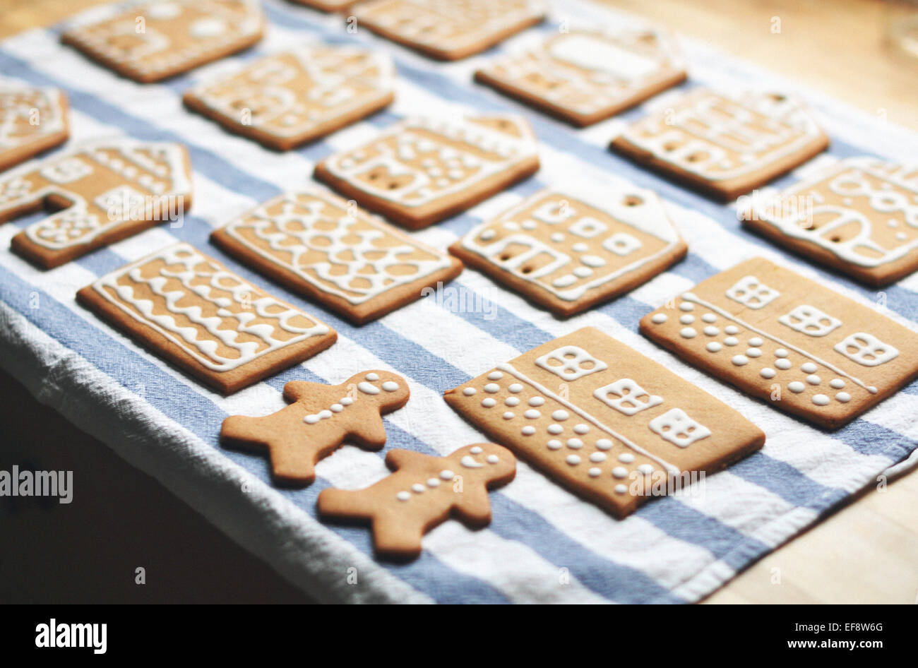 Gingerbread cookies in rows on striped cloth Stock Photo