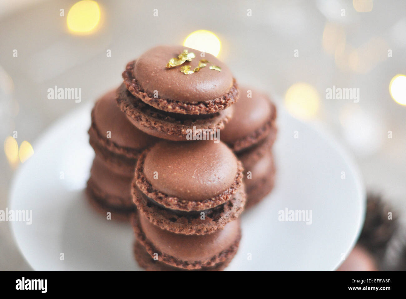 Stack of chocolate macaroons on white plate Stock Photo - Alamy