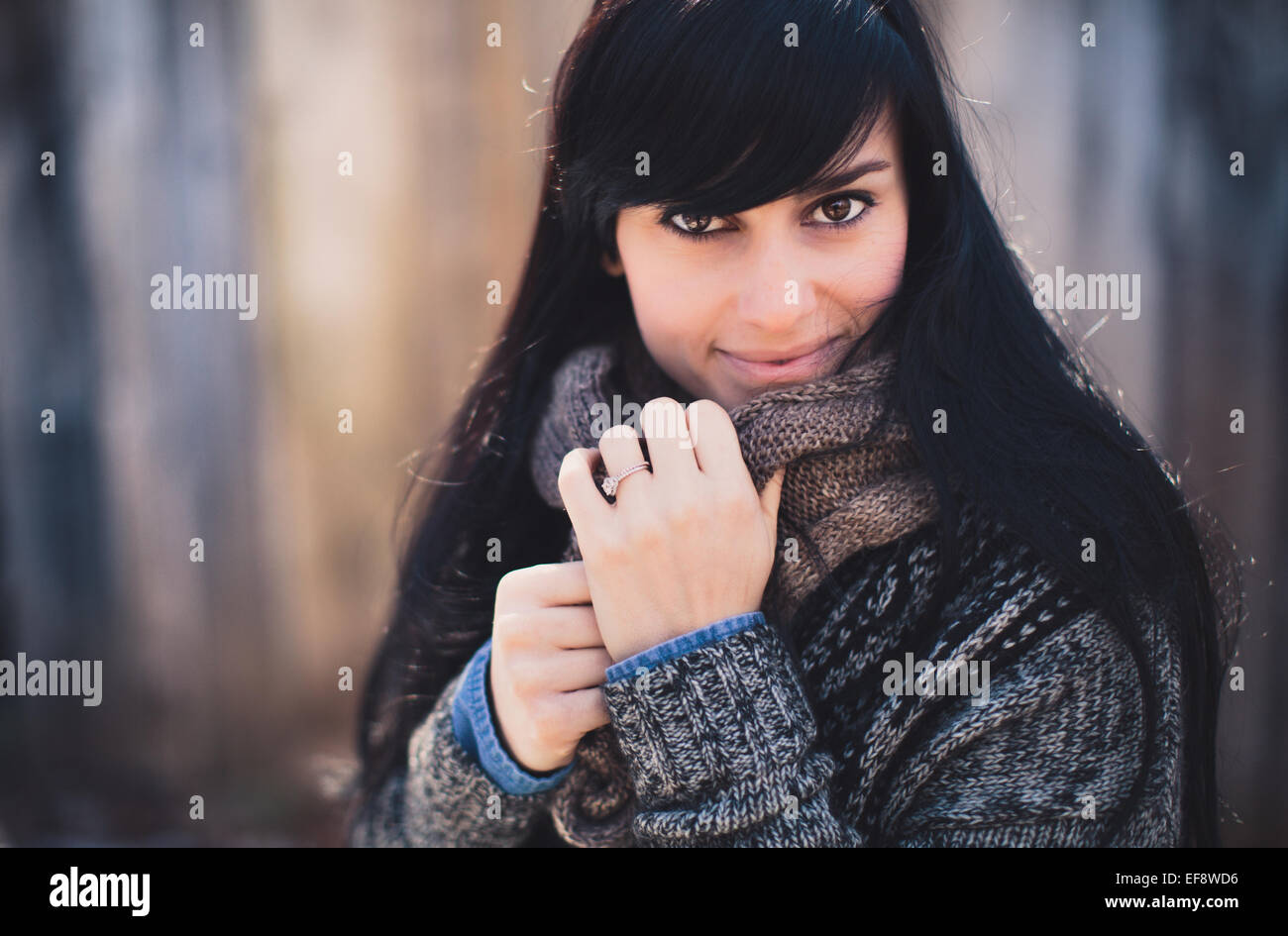 Portrait of a smiling woman wearing warm clothing Stock Photo
