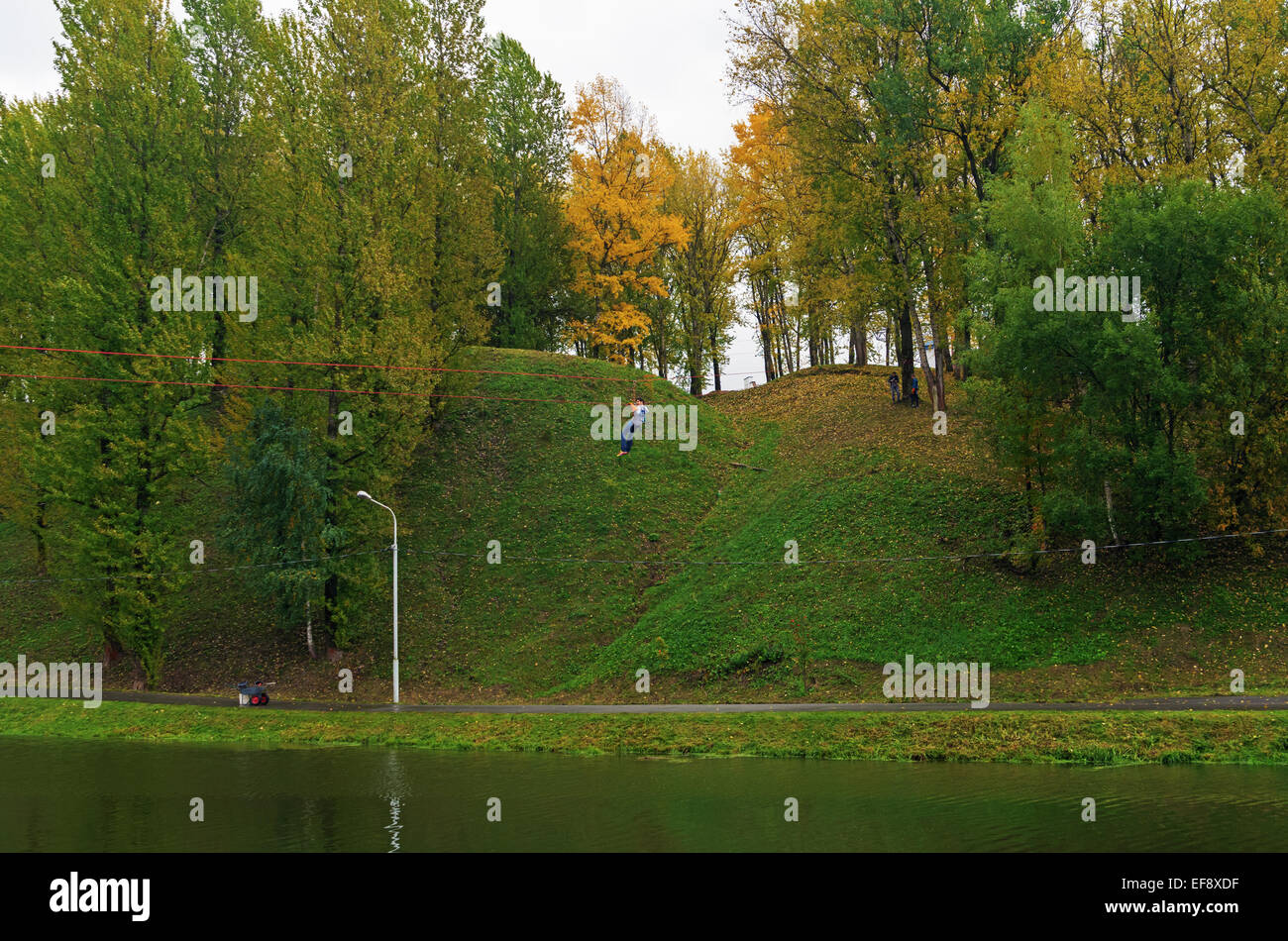 World Tourism Day - sport tourism competition in park on the river Vitba, Vitebsk, inclined crossing on ropes through the river. Stock Photo