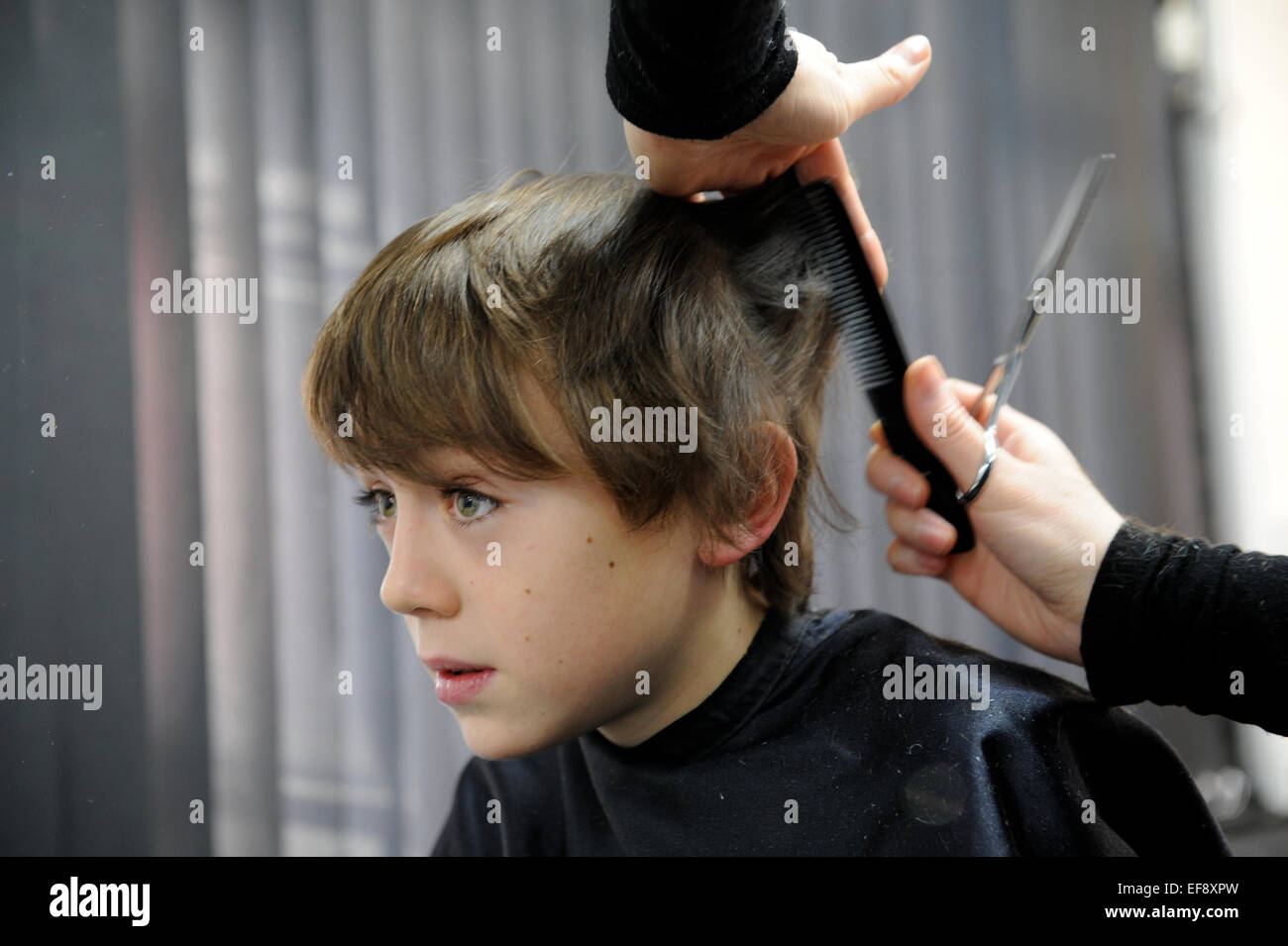 10 Year Old Schoolboy Having A Haircut Stock Photo 78257953 Alamy