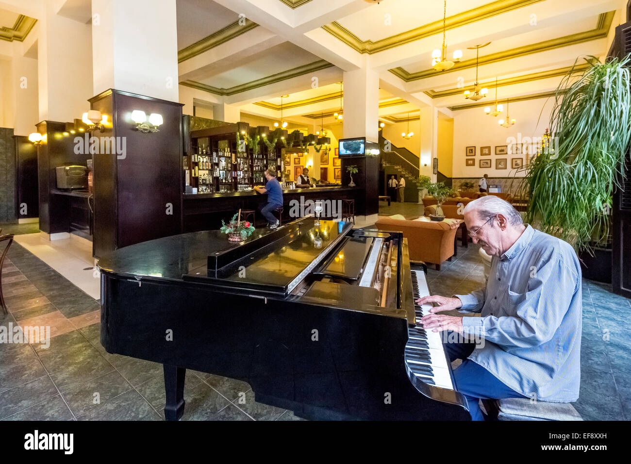 Hotel lobby with a piano player, Amos Mundos Hotel, the hotel of writer Ernest Hemingway, Havana, Cuba Stock Photo