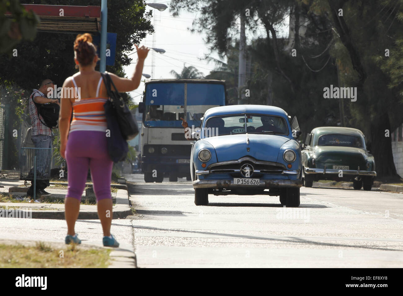 Dec. 22, 2014 Havana, Cuba A woman flags down a ''colectivo'' taxi