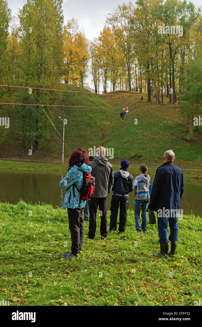 World Tourism Day - sport tourism competition in park on the river Vitba, Vitebsk, inclined crossing on ropes through the river. Stock Photo