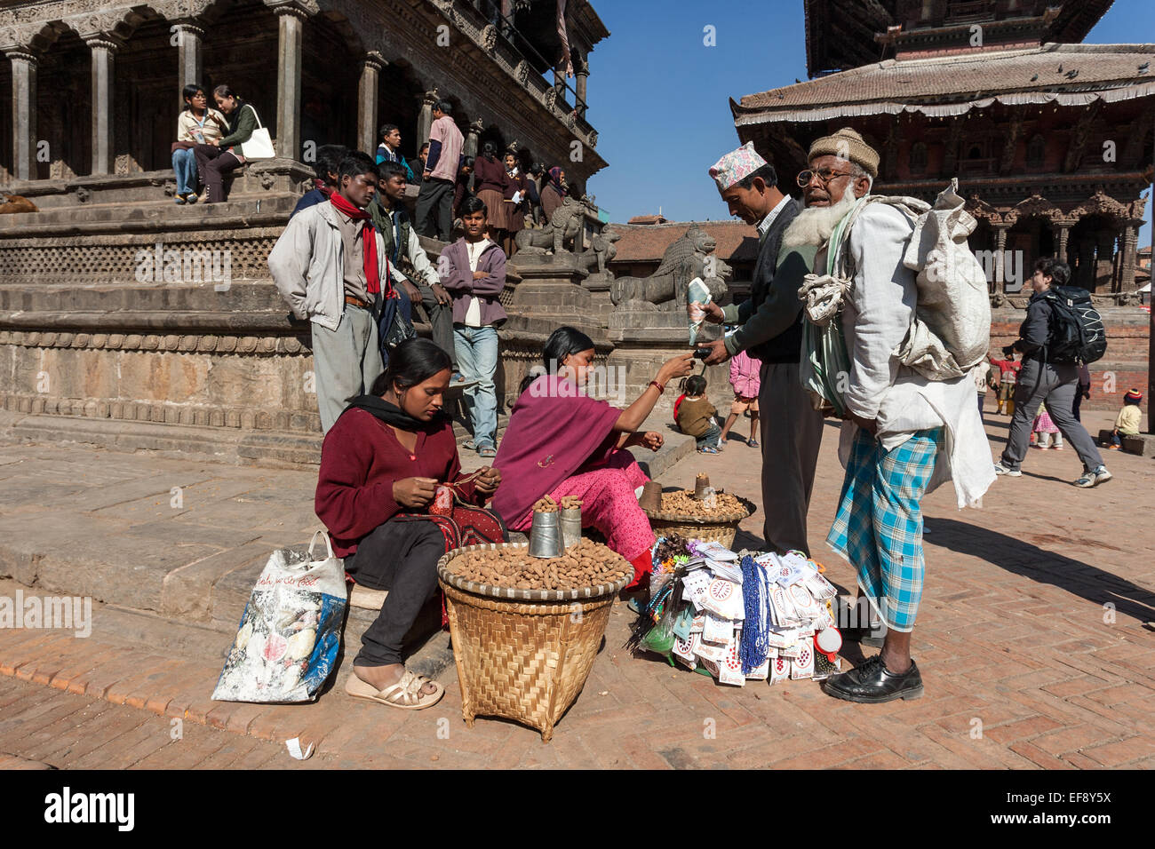 Peanut sellers in front of the Krishna Temple, Durbar Square, Ppatan, Nepal Stock Photo