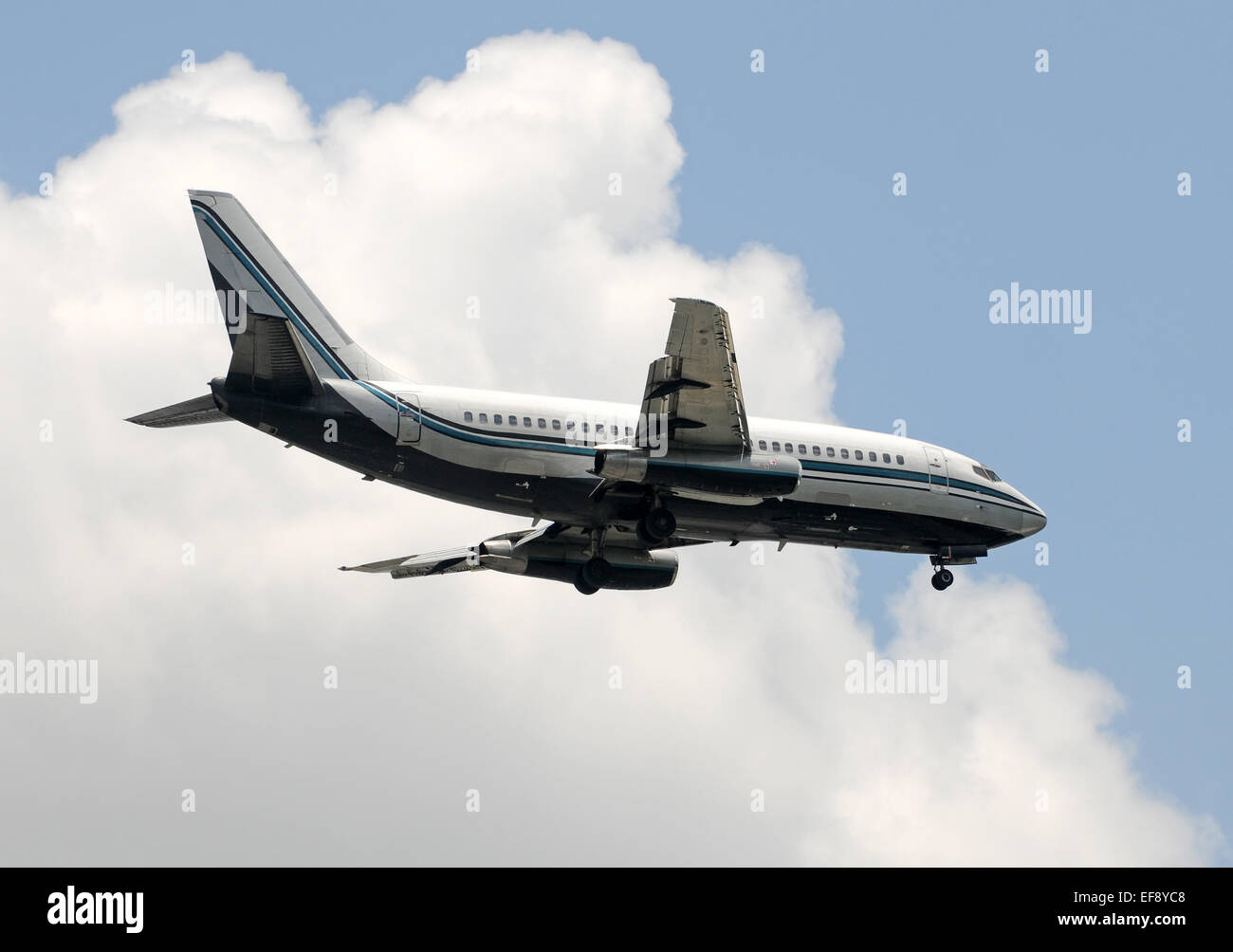 Old passenger jet passing overhead Boeing 737 Stock Photo
