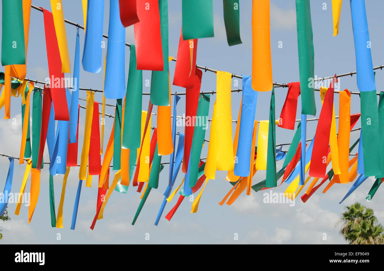 COlorful stripes and flags suspended on rope Stock Photo