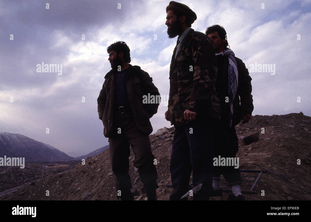 Government soldiers loyal to President Rabbani stand watch over Kabul January 1994 Stock Photo