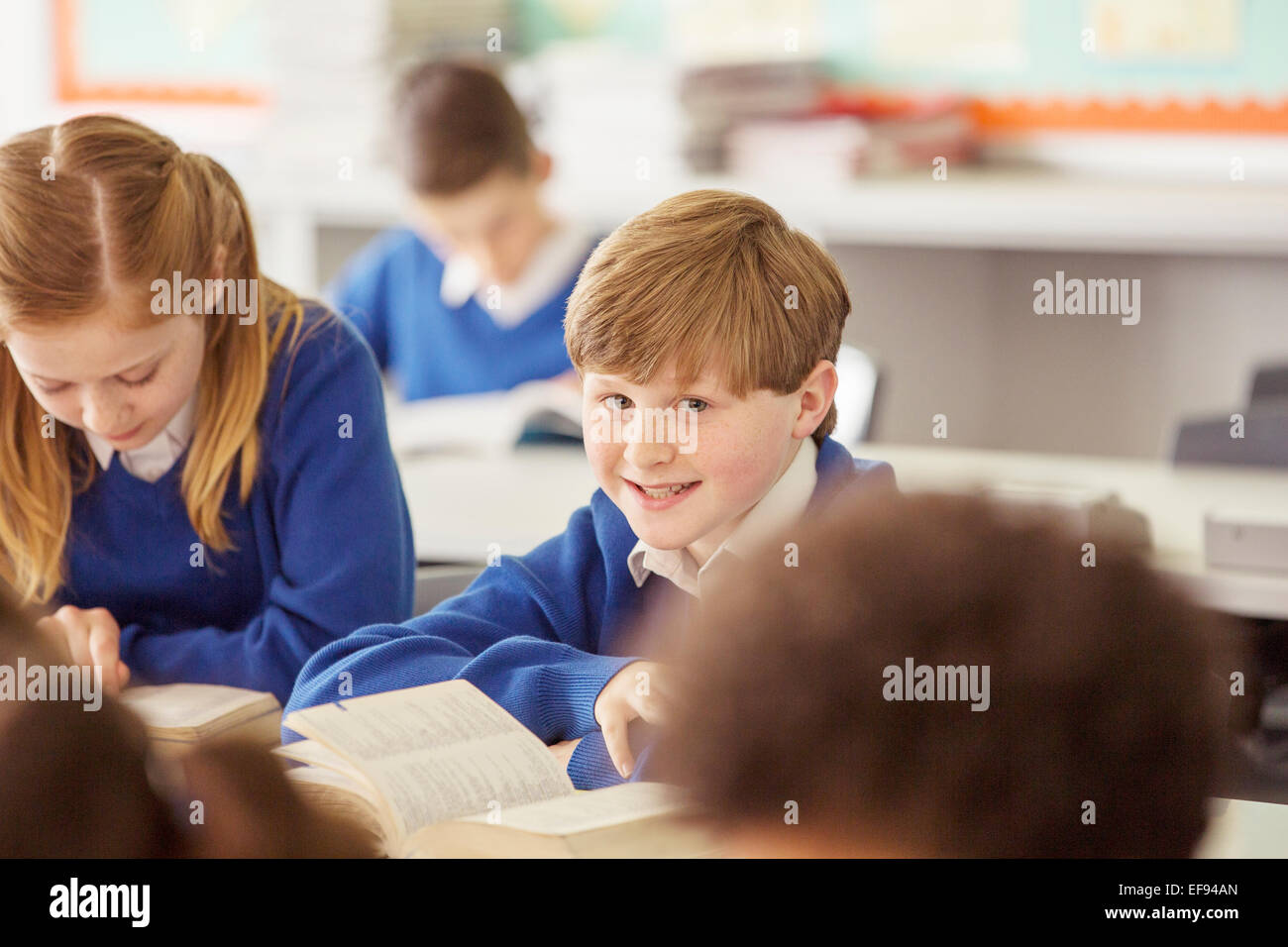 Elementary school children in classroom during lesson Stock Photo