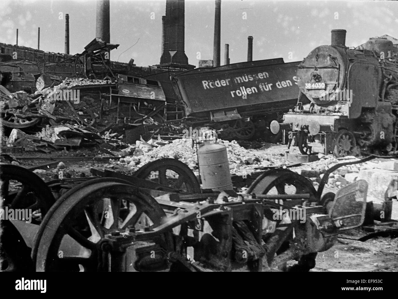The photo by famous photographer Richard Peter sen. shows the terrain of the Deutsche Reichsbahn in Dresden with destroyed locomotives and track installations. Amid the ruins is still the Nazi slogan from war: 'Wheels must roll for victory'. The photo was taken after 17 September 1945. Especially the Allied air raids between 13 and 14 February 1945 led to extensive destructions of the city.  Photo: Deutsche Fotothek / Richard Peter sen. - NO WIRE SERVICE Stock Photo