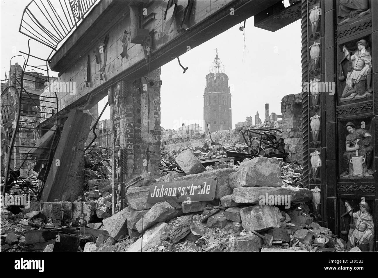 The photo by famous photographer Richard Peter sen. shows the ruins of the Mohrenapotheke in the Johannesstraße (today St. Petersburger Straße) in Dresden. The photo was taken after 17 September 1945. In the back is the destroyed Town Hall tower. Especially the Allied air raids between 13 and 14 February 1945 led to extensive destructions of the city.  Photo: Deutsche Fotothek / Richard Peter sen. - NO WIRE SERVICE Stock Photo