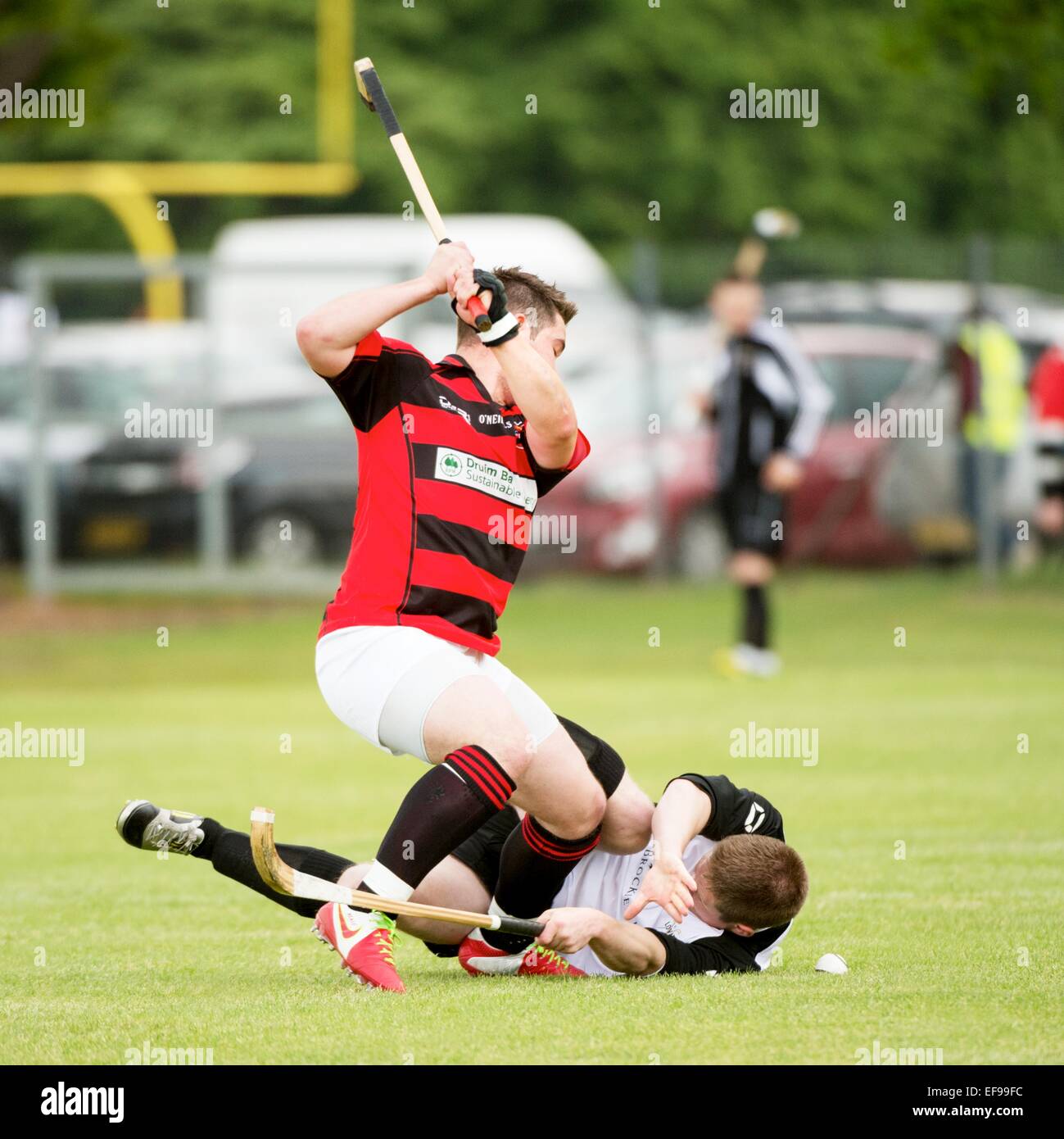 Fierce challenge during Lovat v Glenurquhart - Co-operative MacTavish Cup Final played at The Bught, Inverness, 2013. Stock Photo