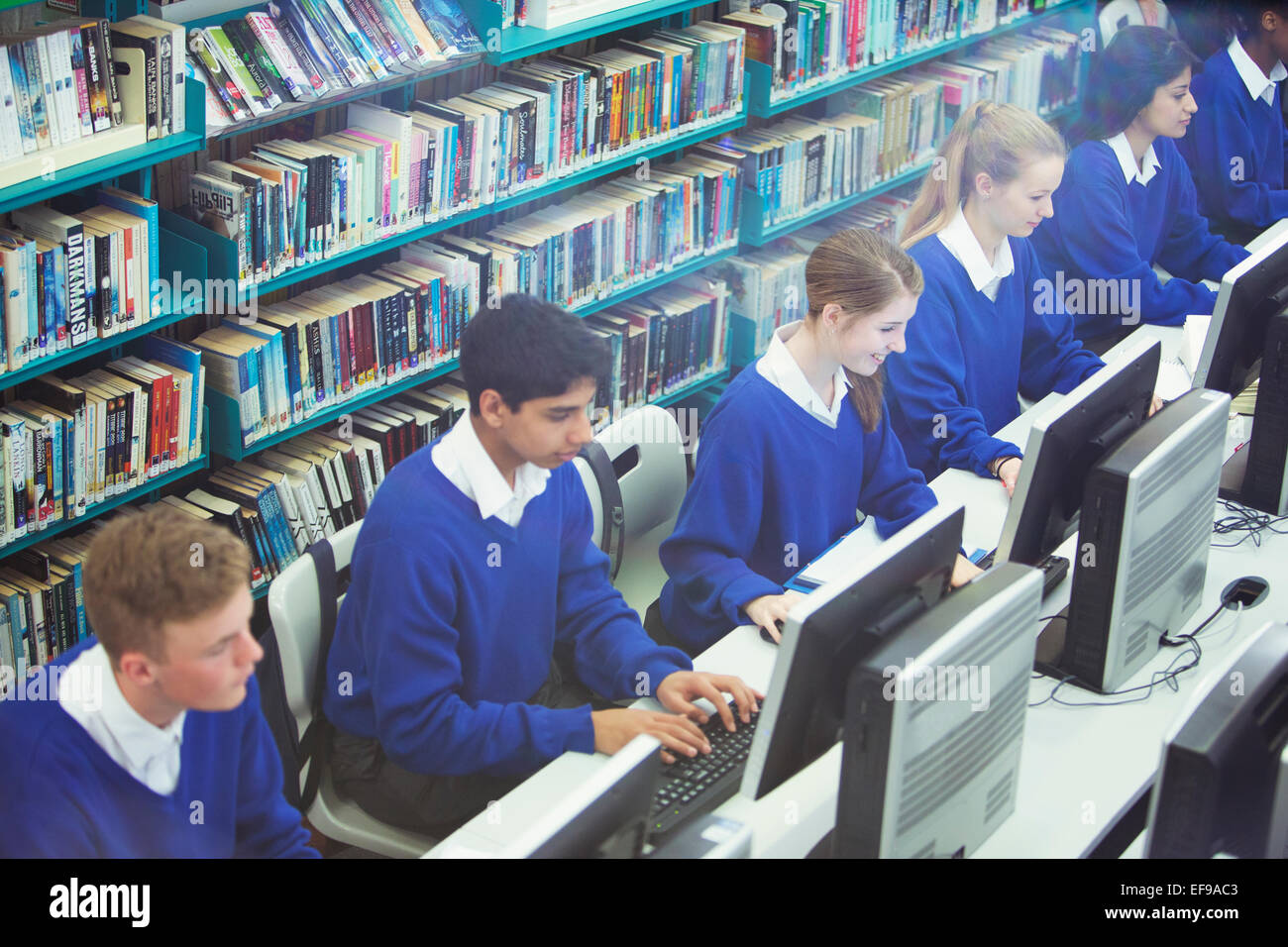 Students working on computers in library Stock Photo