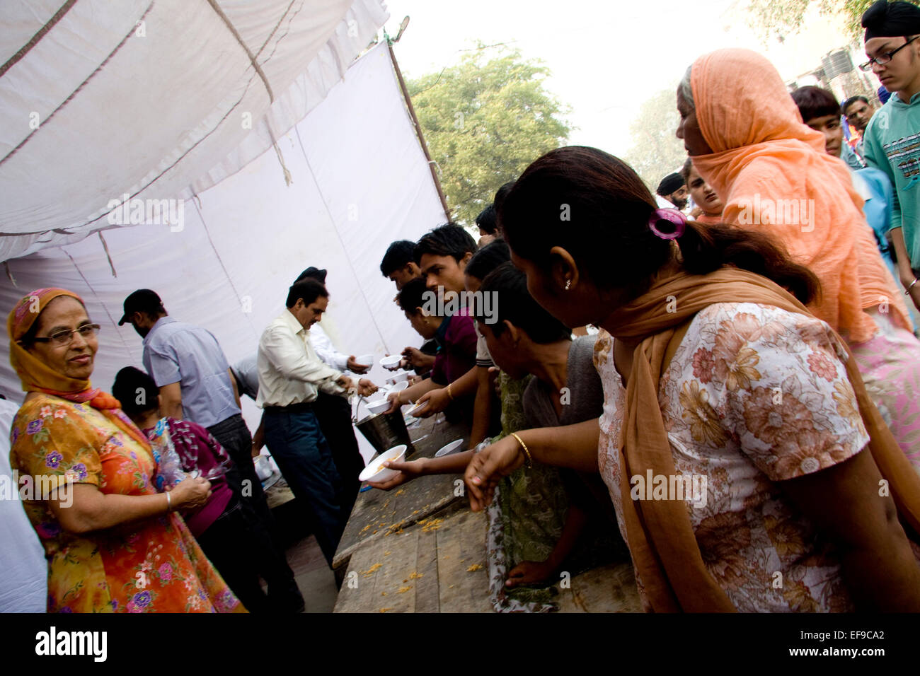 New Delhi, India - November 19, 2011: Sikh people celebrating Guru Nanak birth with a street parade and food distribution Stock Photo