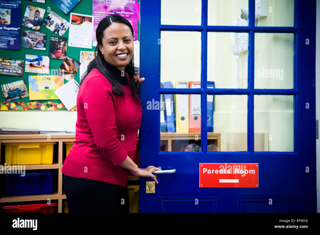 Smiling Teacher outside classroom in Primary School Stock Photo - Alamy