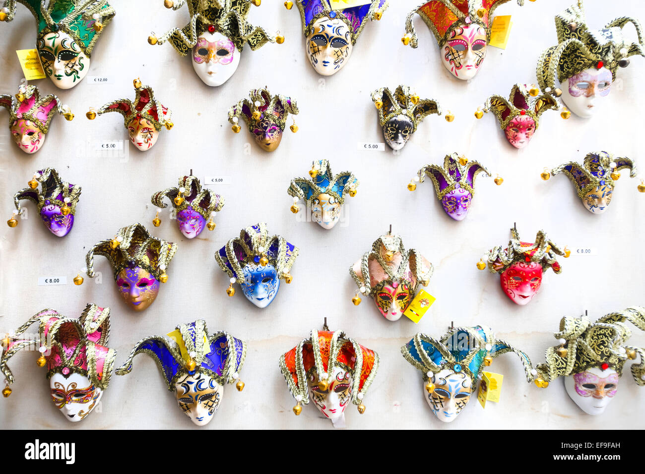 Colorful souvenir carnival masks with magnets displayed for sale on stand  in Venice, Italy Stock Photo - Alamy
