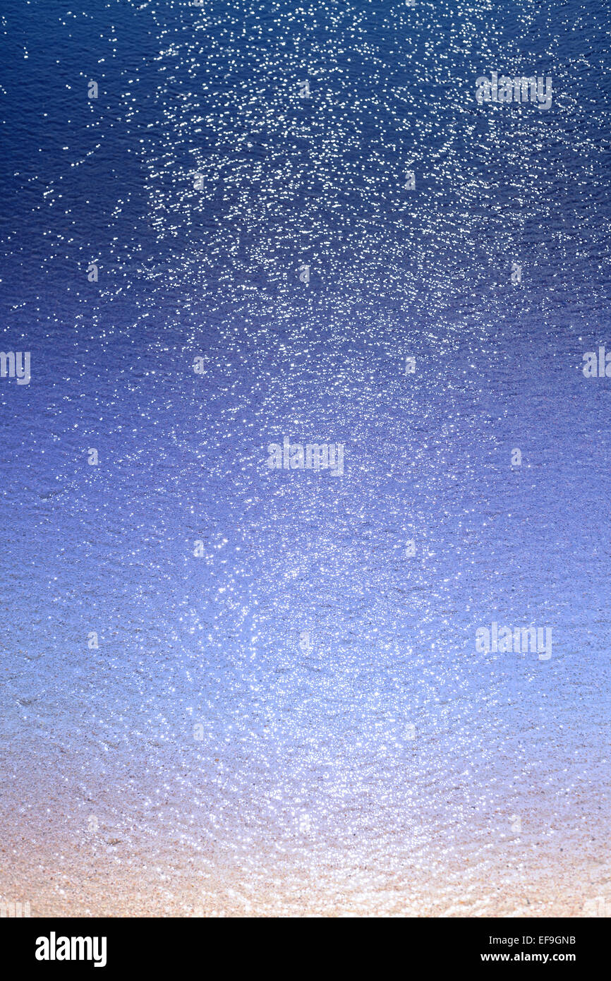 Blurred sea with glitter and bokeh, abstract background. Stock Photo
