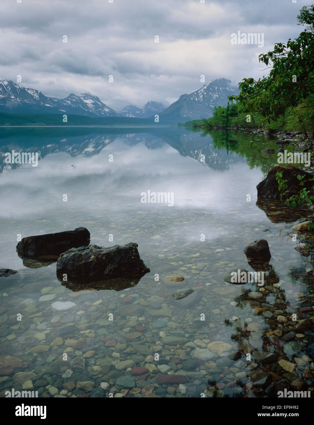 An overcast sky on mirrorlike St. Mary Lake,Glacier National Park
