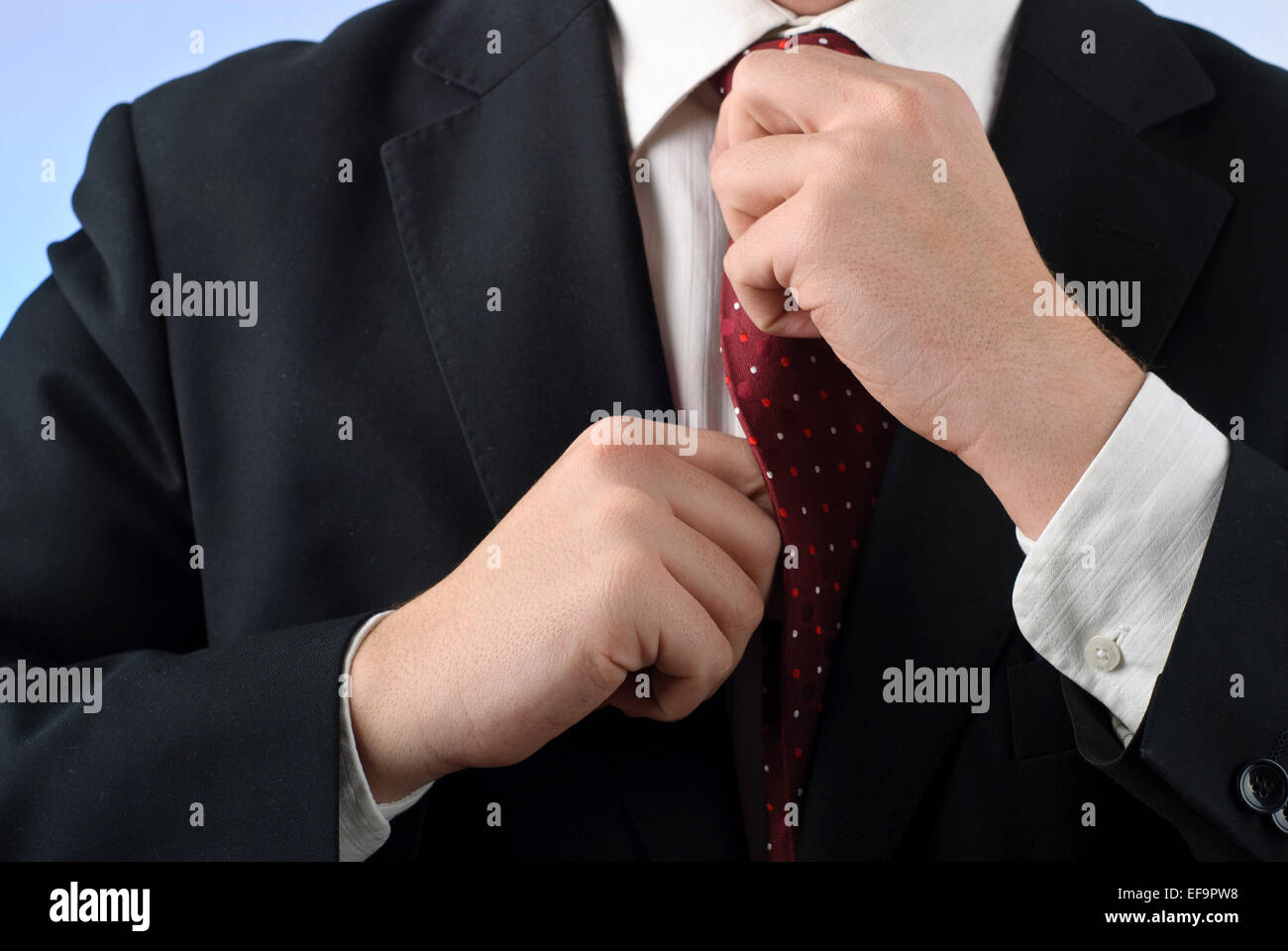 Man adjust tie hi-res stock photography and images - Alamy