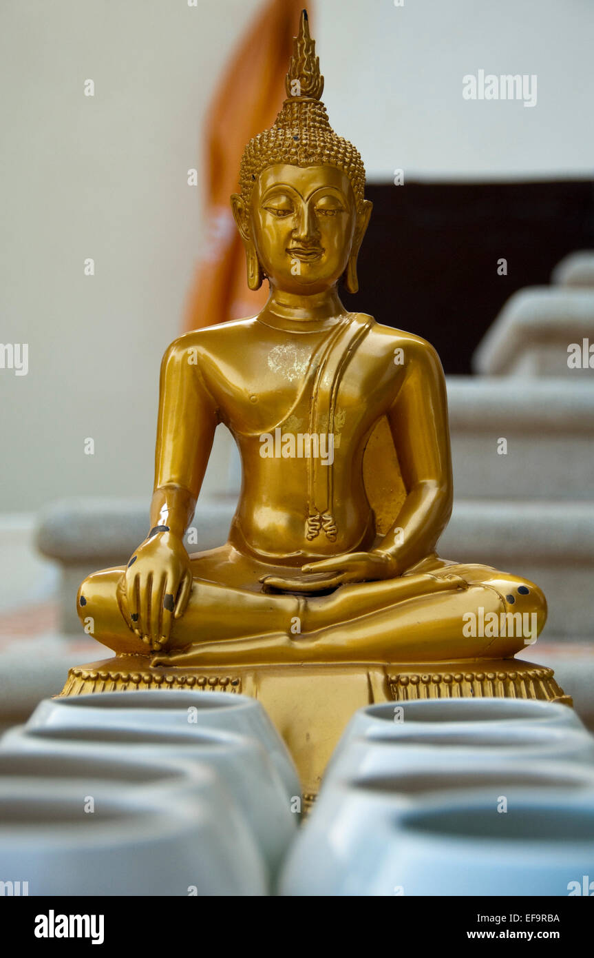 Vertical close up of a gold Buddha statue at Wat Doi Suthep in Chiang Mai. Stock Photo