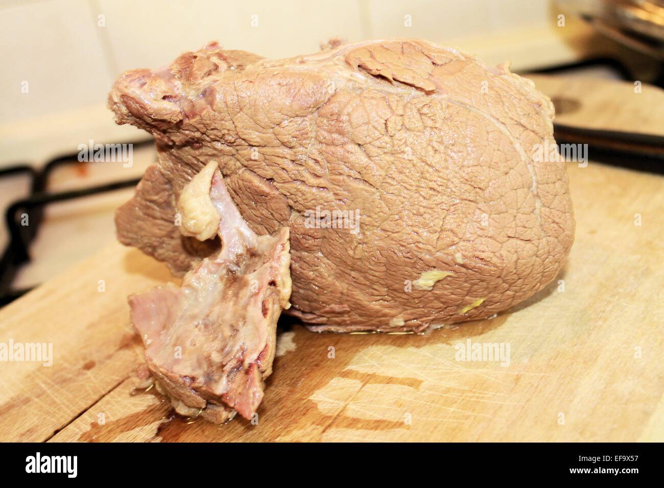boiled beef on wooden cutting board Stock Photo