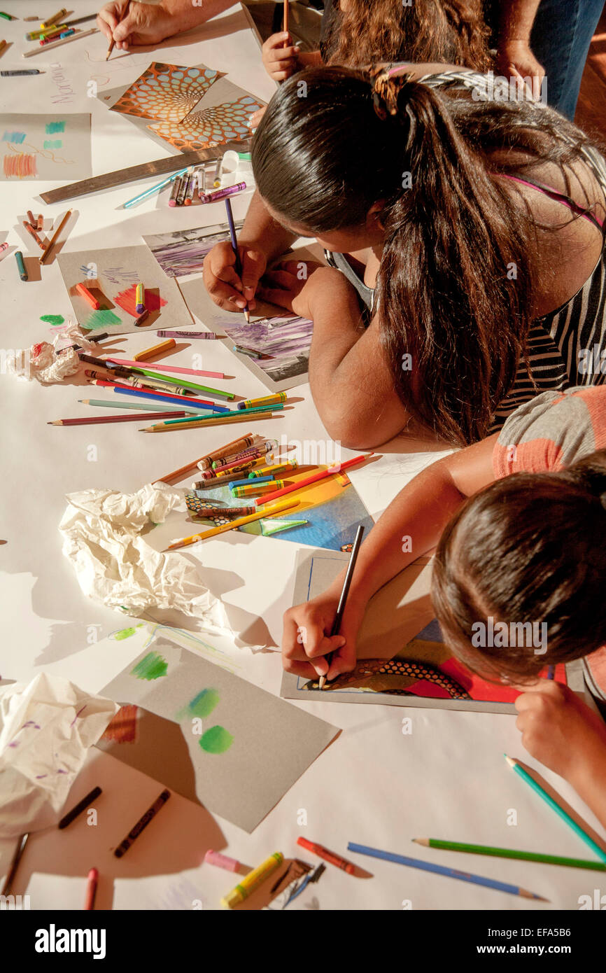 A middle school Hispanic teen girl work on her picture at a free art class  in Laguna Beach, CA. Note art supplies Stock Photo - Alamy