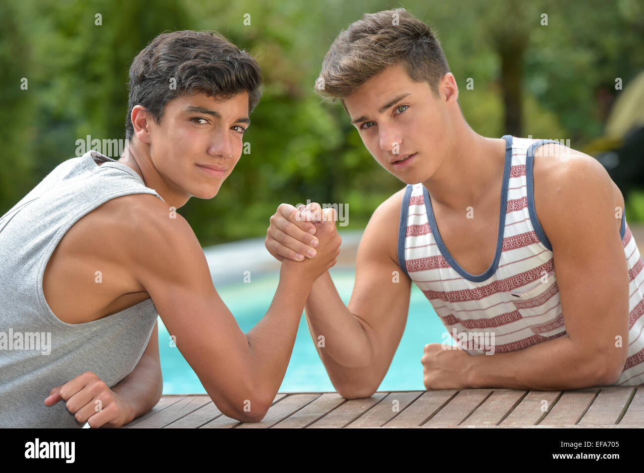 Twin Brothers Arm Wrestling-Teenagers Stock Photo