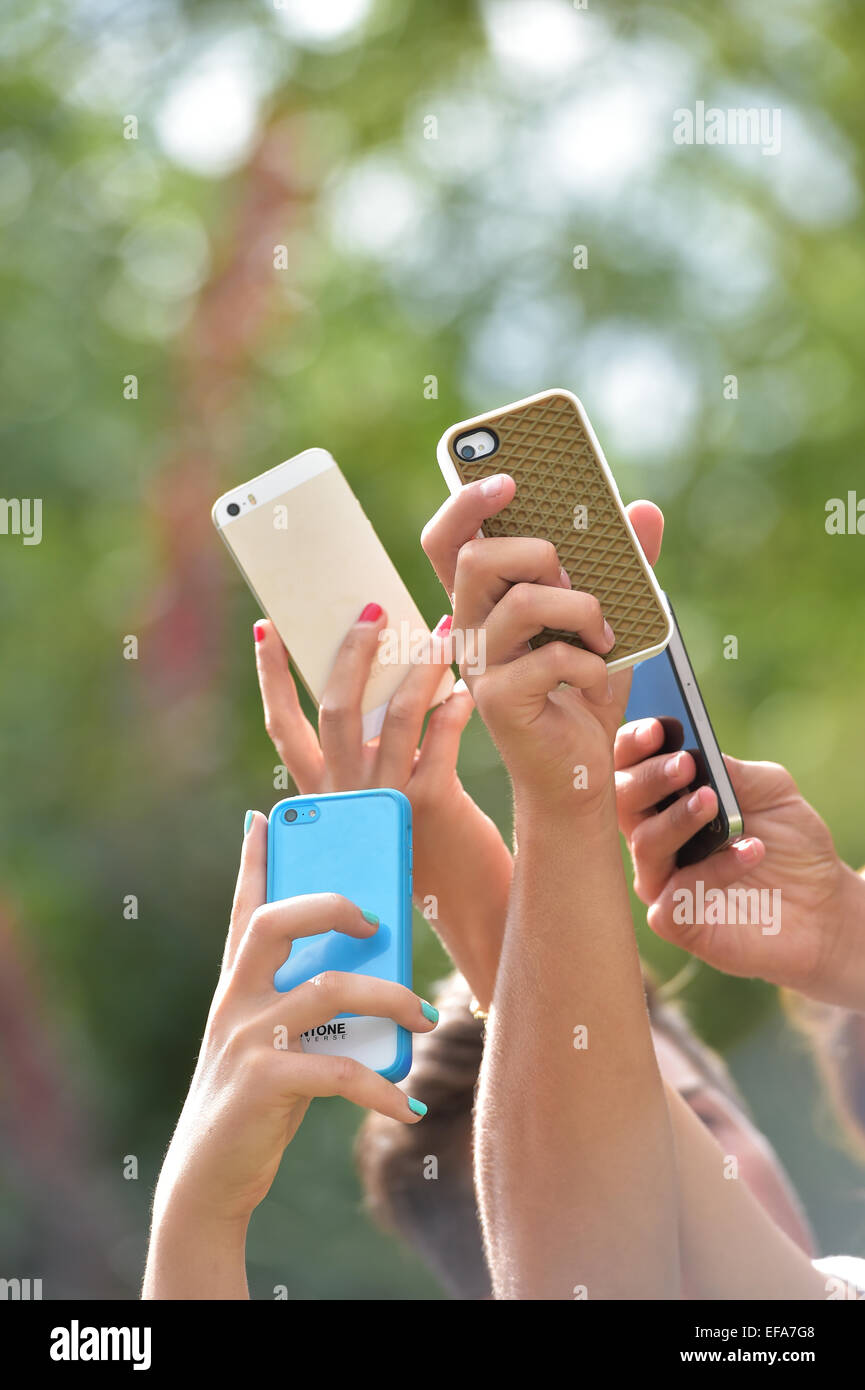 Teenagers only Hands lift smart phones Stock Photo