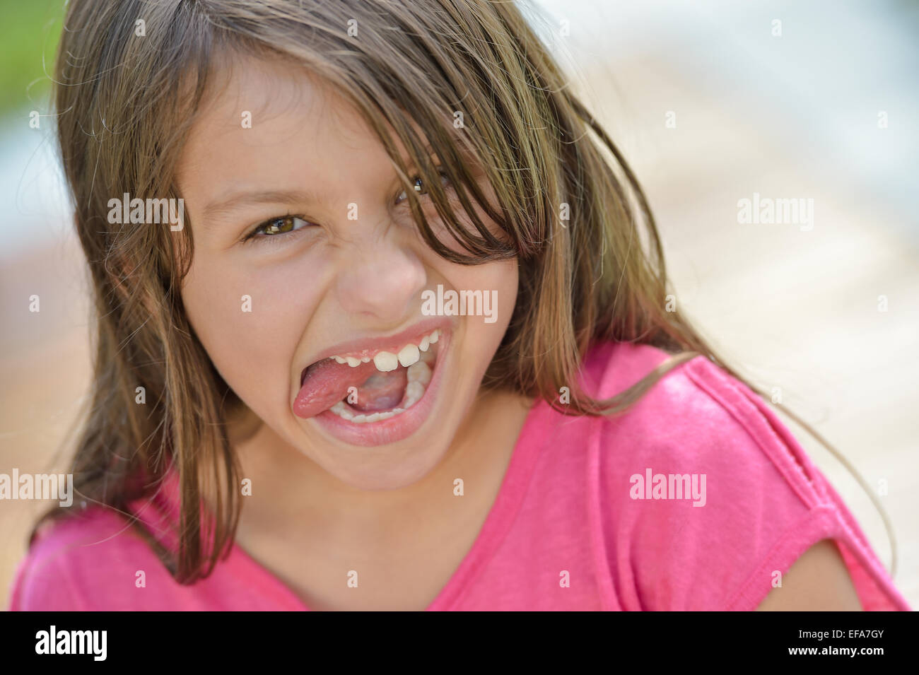 Preteen faces tongue 
