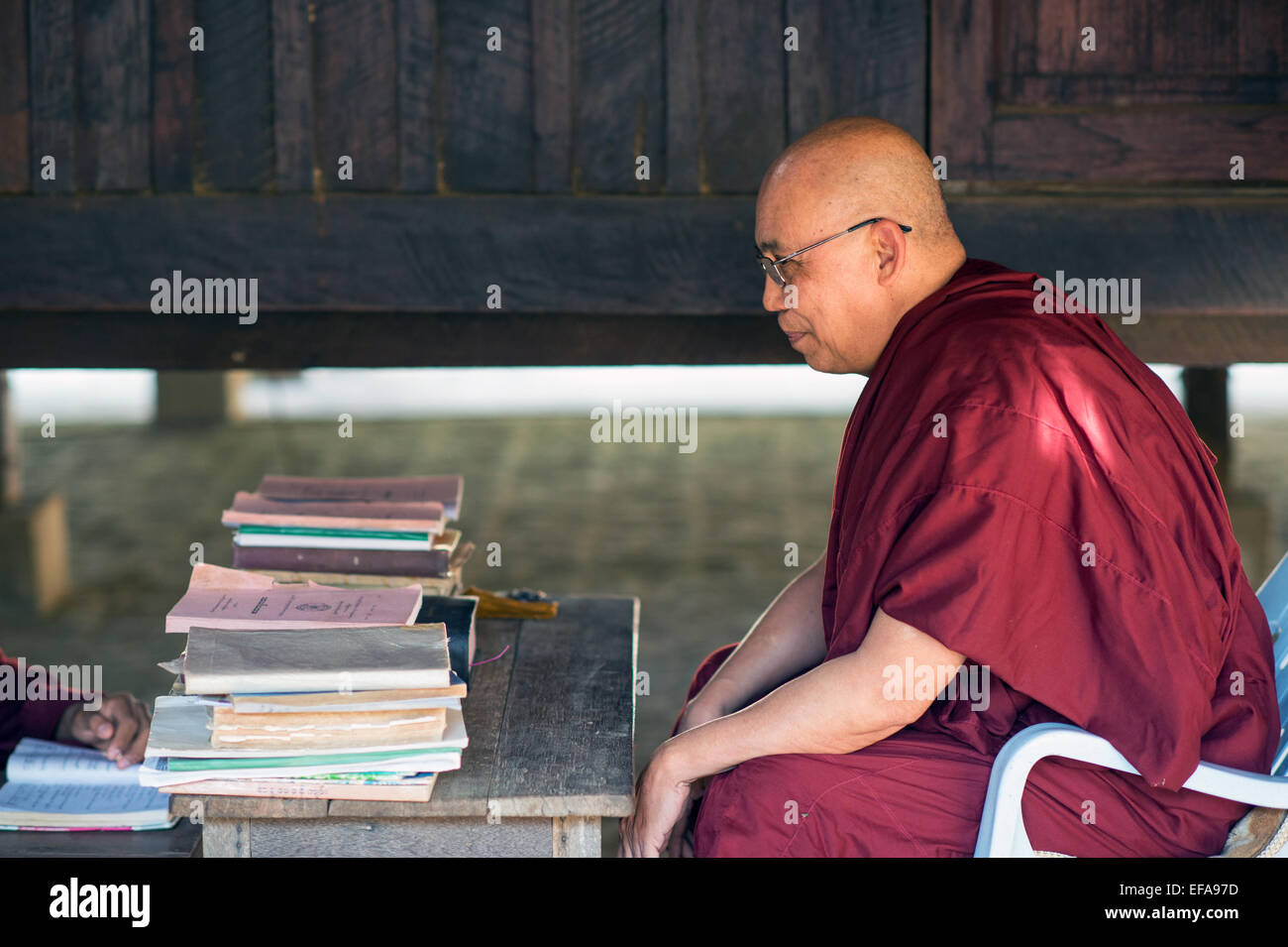 Burmese monk teaching Buddhism in a monastery in Bagan. Stock Photo