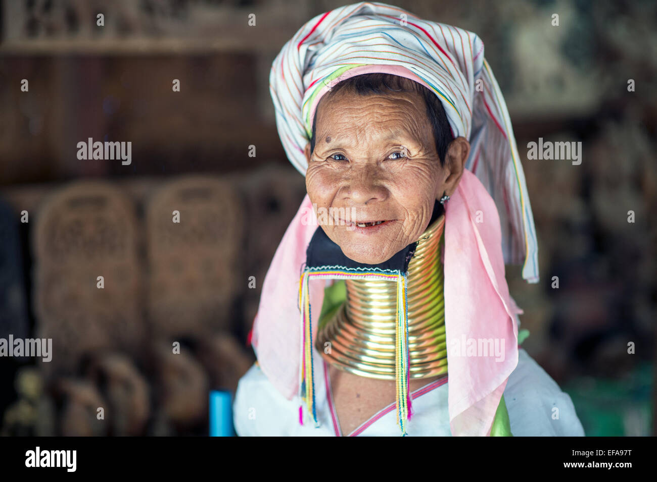 Portrait of a long neck Kayan woman. Brass coils creating long necks is a tradition of the Kayan Lahwi women. Stock Photo