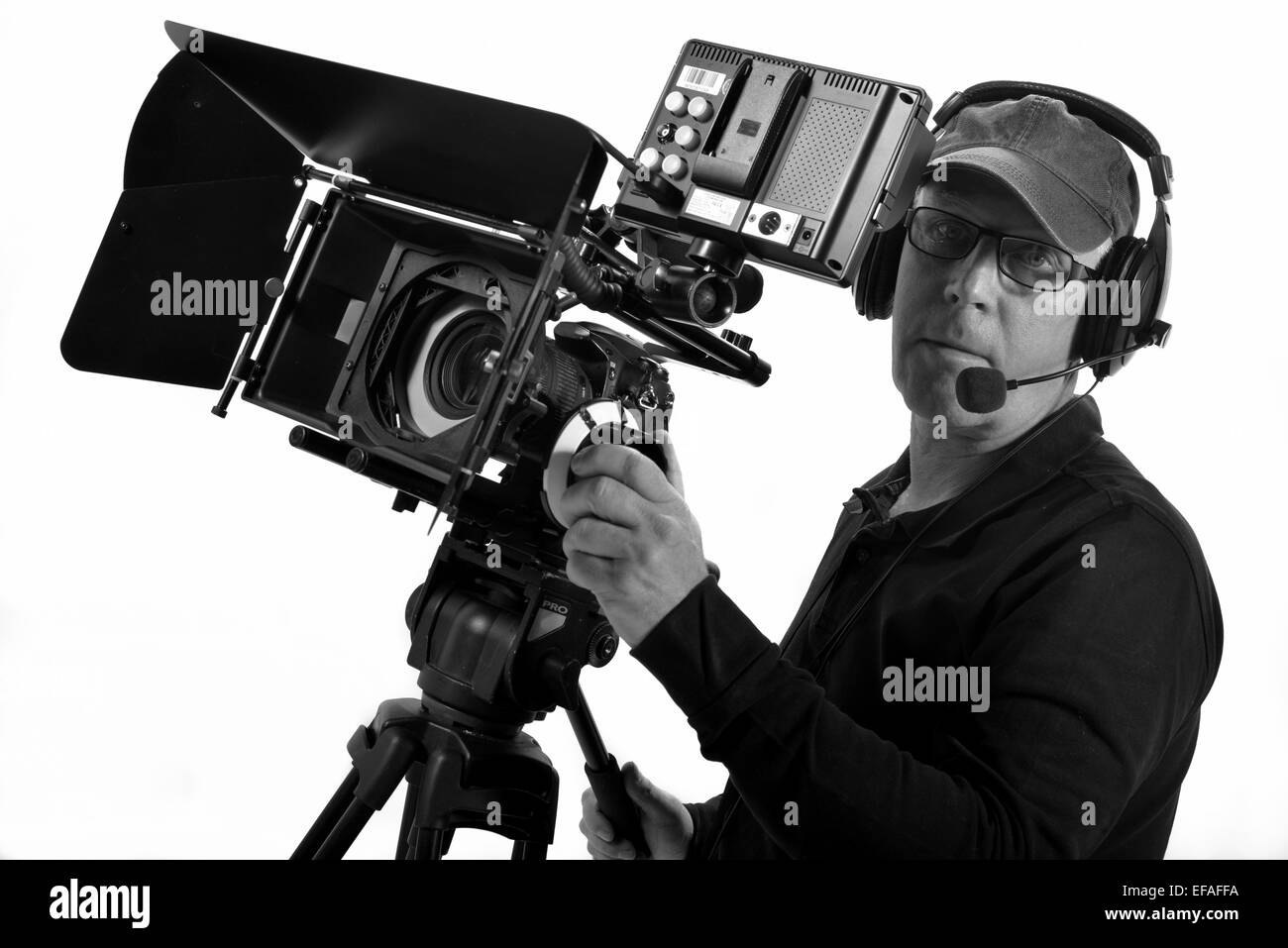 man equip a helmet with a handheld camera Stock Photo