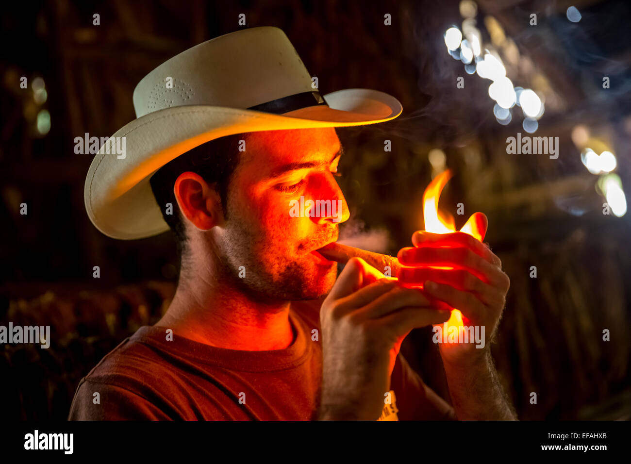 Tobacco farmer Luis Manne Alvares Rodrigues lighting a Havana cigar, tobacco farm, Vinales Valley, Vinales Stock Photo