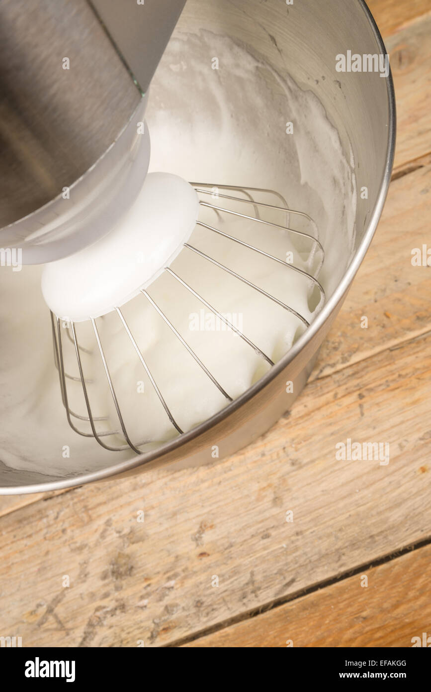 Egg whites being whisked inside a modern food processor Stock Photo Alamy