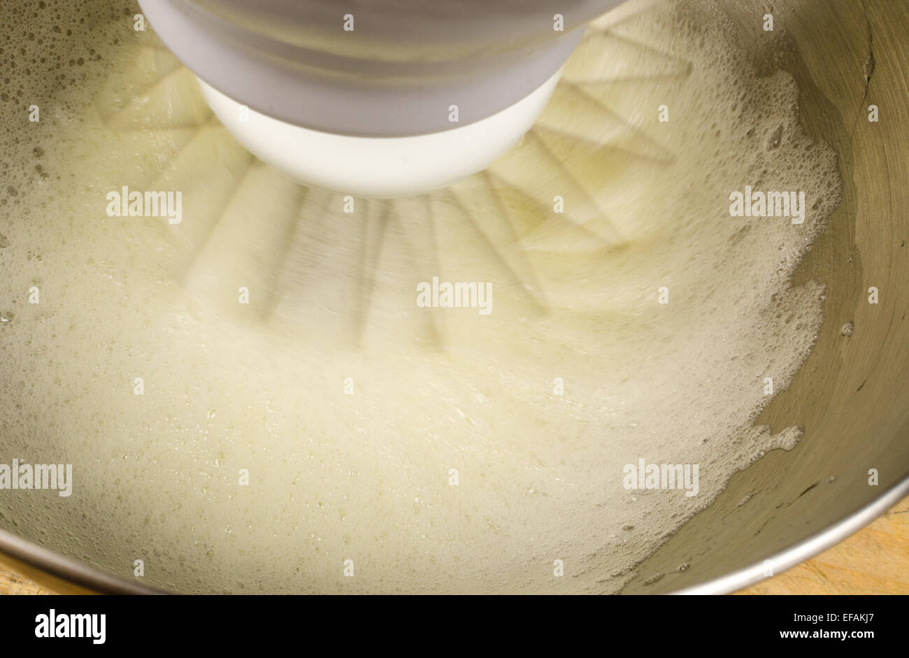 Egg whites being whisked inside a modern food processor Stock Photo Alamy