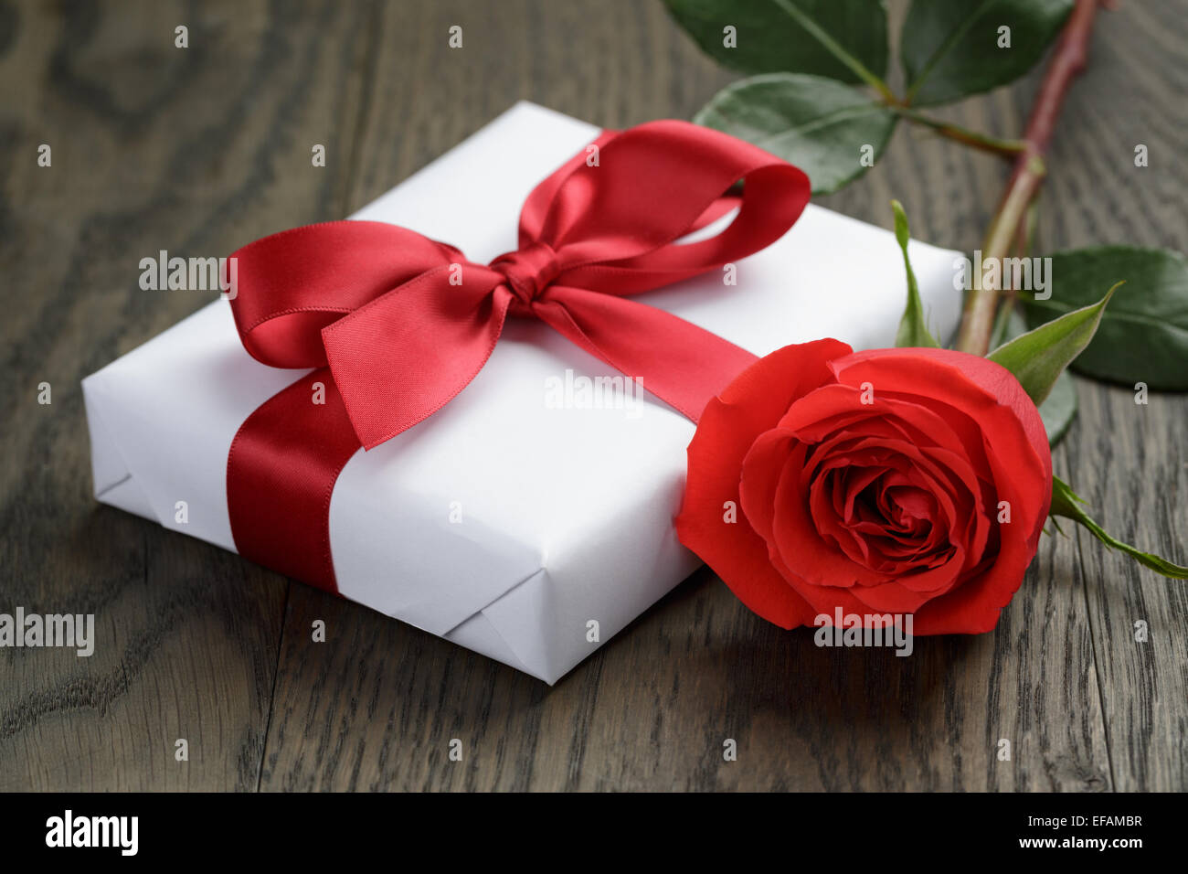 present box with ribbon bow and rose Stock Photo