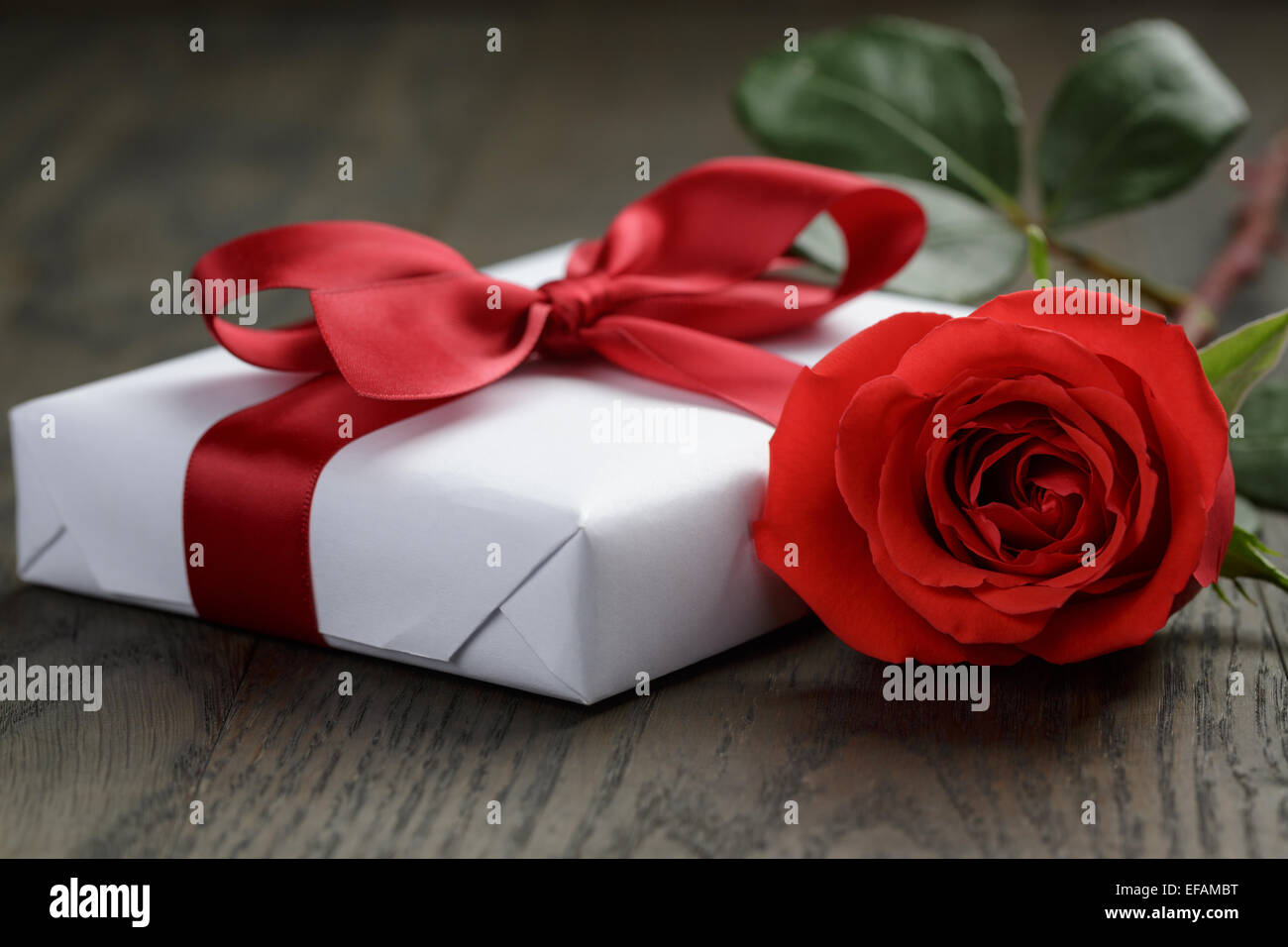 present box with ribbon bow and rose Stock Photo