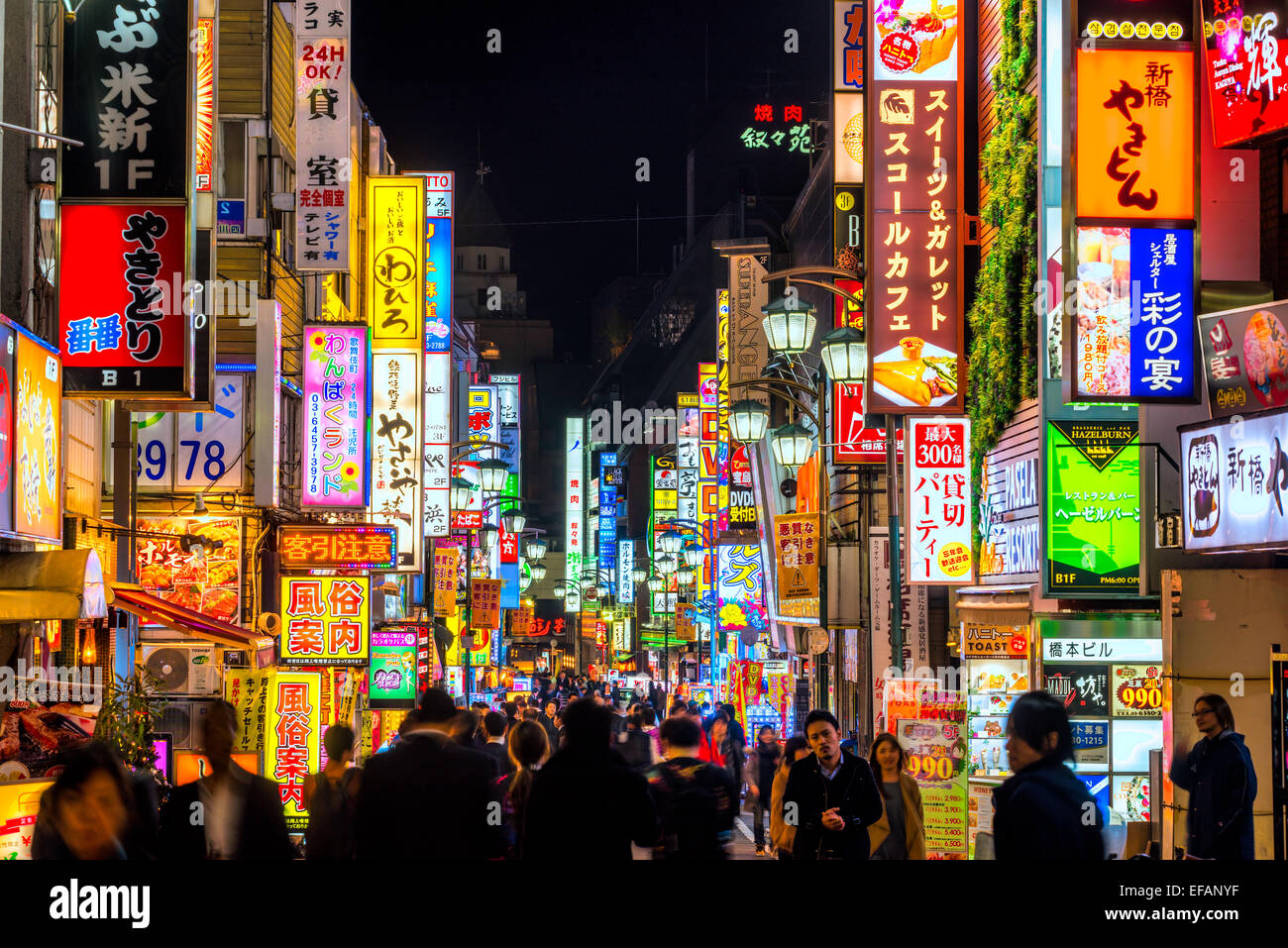 TOKYO - NOVEMBER 13: Billboards in Shinjuku's Kabuki-cho district November 13, 2014 in Tokyo, JP. The area is a nightlife distri Stock Photo