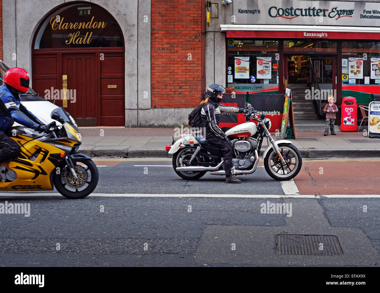 Young woman riding a Harley Davidson motorcycle in Dublin Ireland Stock Photo