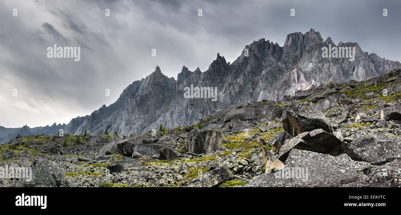 Toothed ridge mountains in cloudy weather in Eastern Siberia Stock Photo