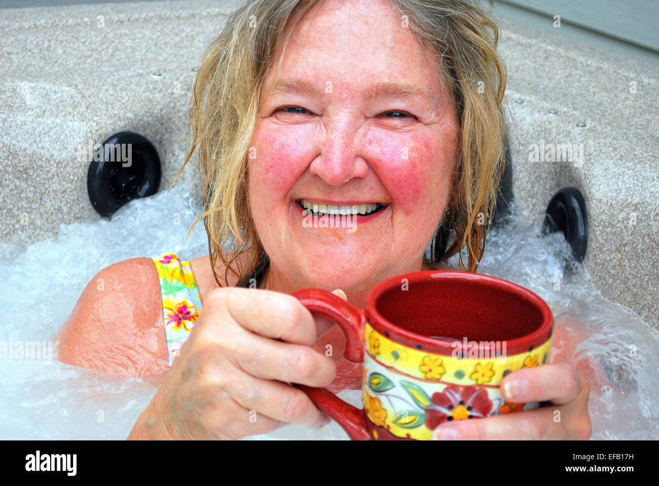 Female relaxing in her hot tub Stock Photo Alamy