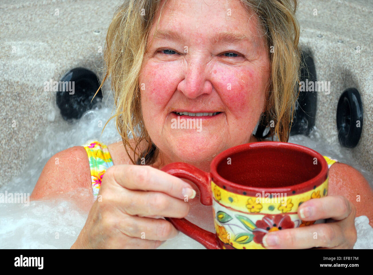Female relaxing in her hot tub Stock Photo Alamy